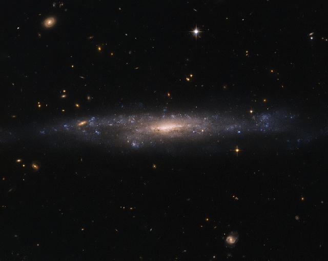 This striking NASA/ESA Hubble Space Telescope image captures the galaxy UGC 477, located just over 110 million light-years away in the constellation of Pisces (The Fish). 